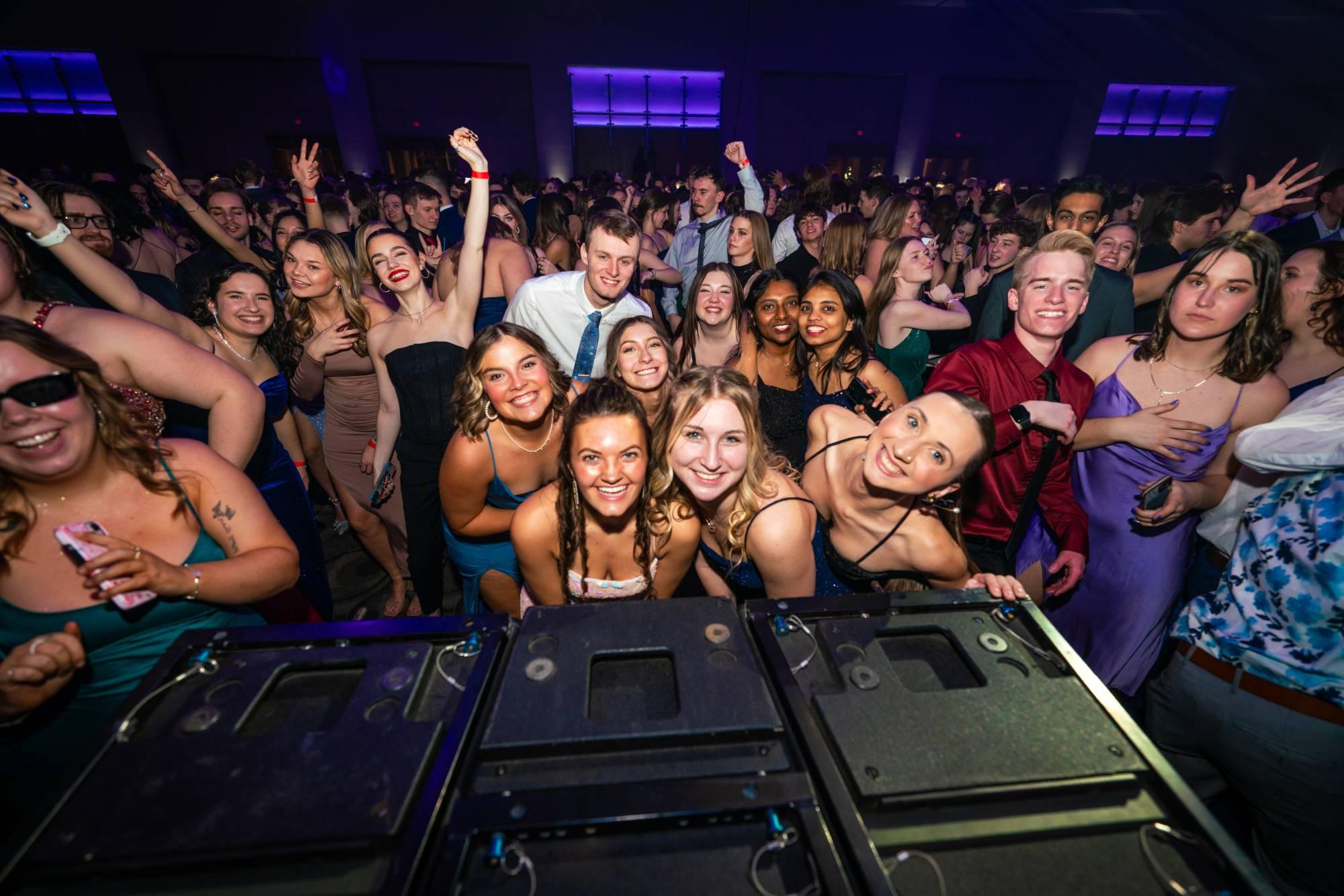 Students dancing and smiling for the camera at Presidents' Ball